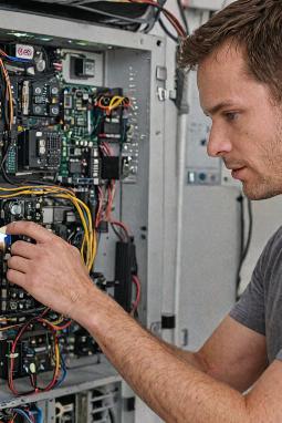Technician installing phone equipment